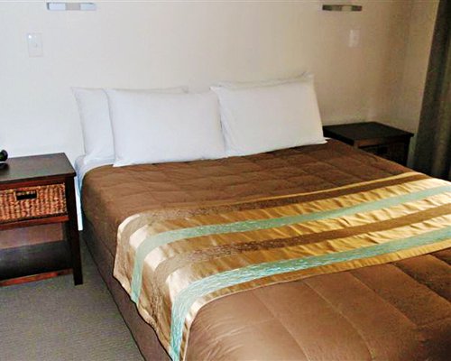 A well furnished bedroom with a queen bed.