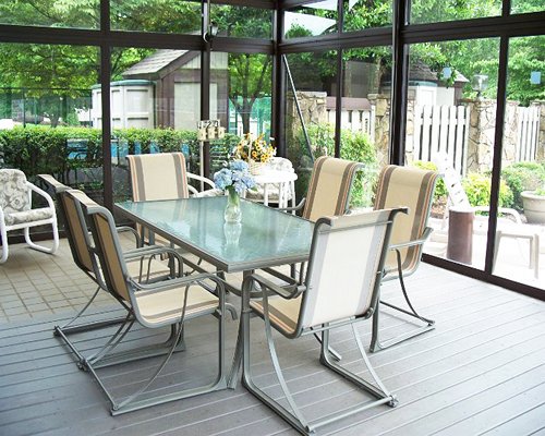 A well furnished dining area with an outside view.
