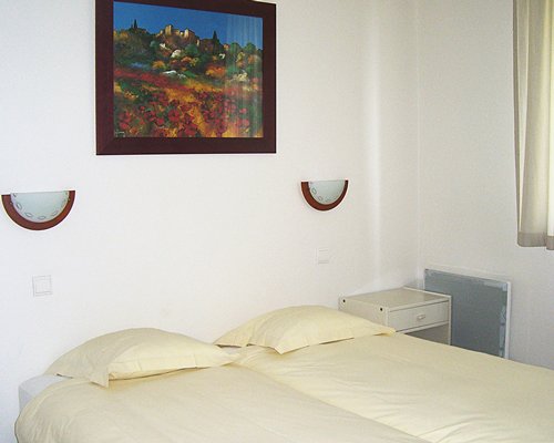 A well furnished bedroom with two beds.