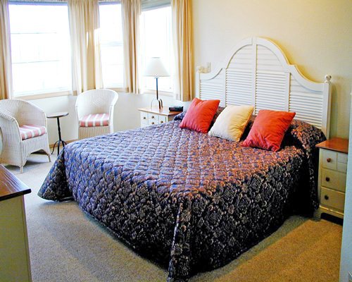 A well furnished bedroom with a king bed.