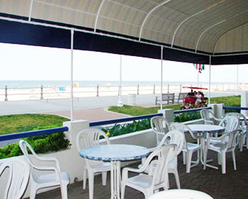 A well furnished indoor fine dining restaurant with an ocean view.
