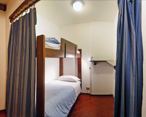 Furnished bedroom with bunker beds.