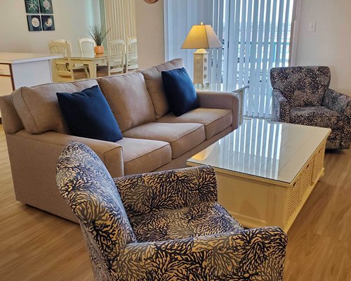 An open plan living and dining area with a television and a fireplace.