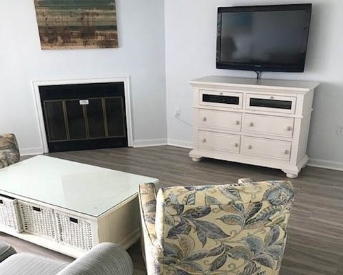 A well furnished bedroom with two twin beds and an outside view.