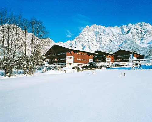 Exterior view of Marco Polo Club Alpina during winter.