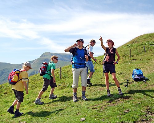 A group of people hiking on the mountain.