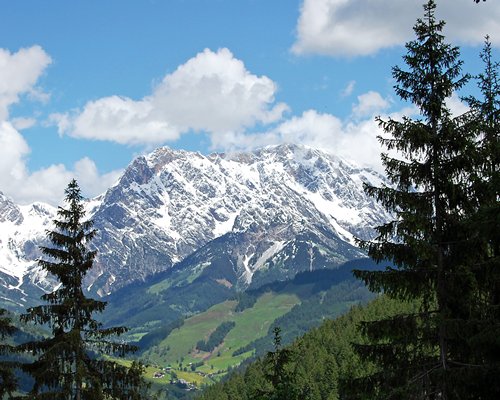 A scenic view of a snowy mountain.