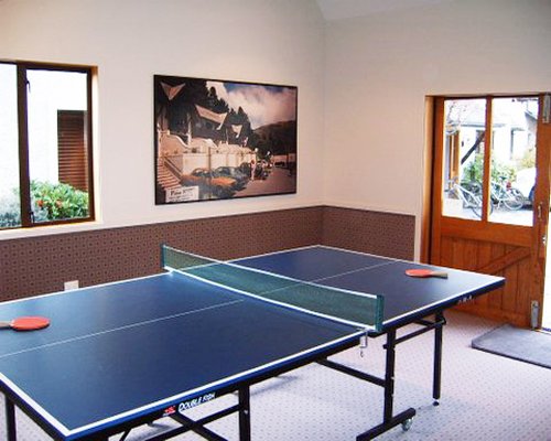 An indoor recreation room with ping pong.