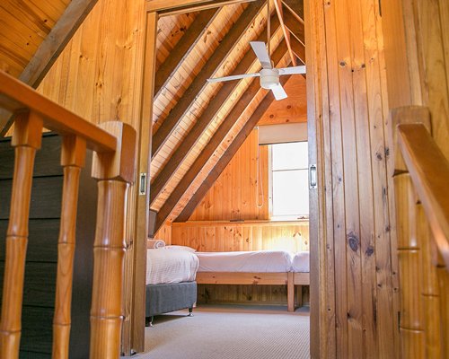 Entry into furnished bedroom with multiple beds.