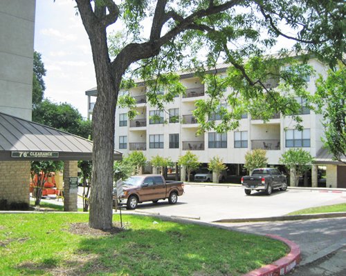 Scenic exterior view of the Inverness at New Braunfels with parking area.