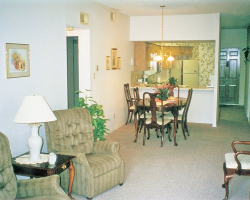 An open plan living dining and kitchen area with breakfast bar.