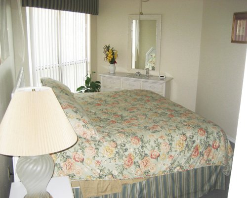 A well furnished bedroom with an outside view.
