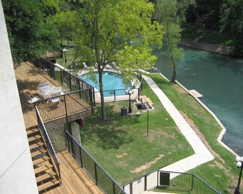 Balcony view of an outdoor swimming pool.