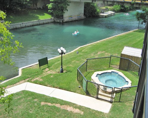 An aerial view of outdoor hot tub alongside the waterfront.