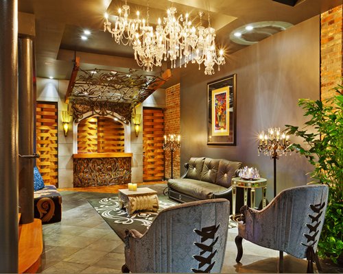A well furnished living room with chandelier.