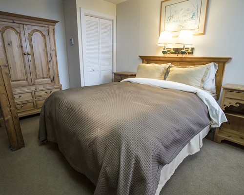 A well furnished bedroom with a queen bed.