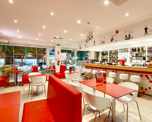 Indoor restaurant and bar at Ourapraia Aparthotel.