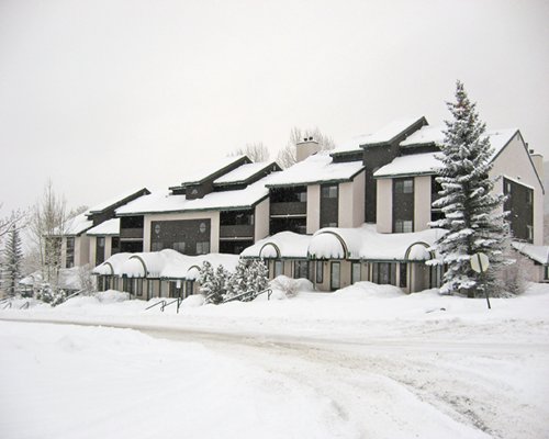 Exterior view of the resort unit covered by snow.