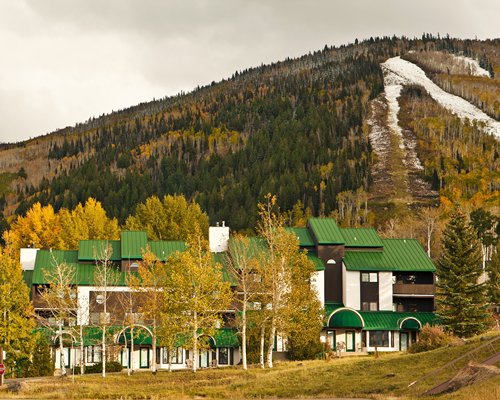 Scenic exterior view of the resort unit alongside the mountain.