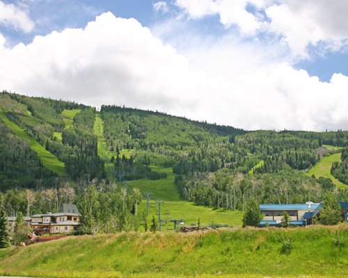 Scenic exterior view of the resort unit alongside the mountain.