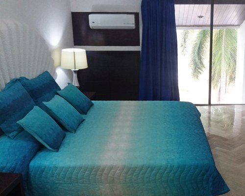 A well furnished bedroom with outdoor view.