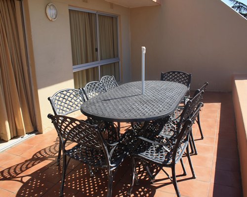 A balcony with patio furniture.