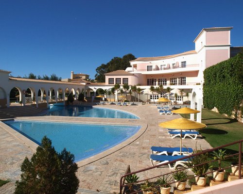 Scenic view of a kids playscape with slide alongside resort unit.
