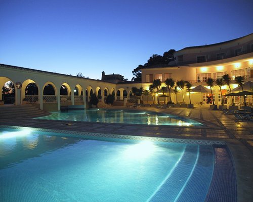 A view of the resort corridor with the outdoor swimming pool.