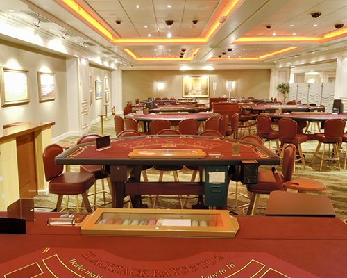 Indoor recreation room with casino tables.