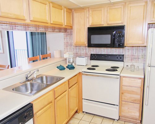 A well equipped kitchen with microwave oven.