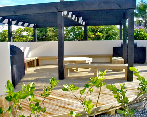 An outdoor picnic area with barbecue grill.