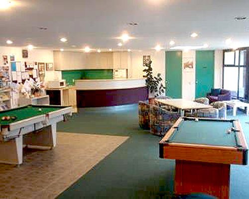 An indoor recreation room with pool tables.