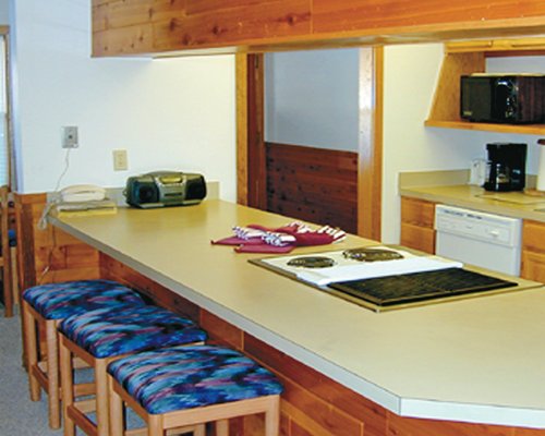 An open plan kitchen with breakfast bar.