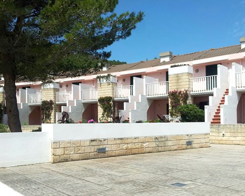 Scenic exterior view of multiple units with balconies at Residence I Delfini Di Pugnochiuso.