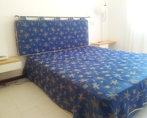 A well furnished bedroom with an outside view.