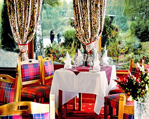 An indoor fine dining restaurant with an outside view.