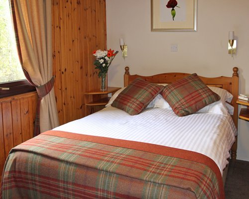 A well furnished bedroom with an outside view.