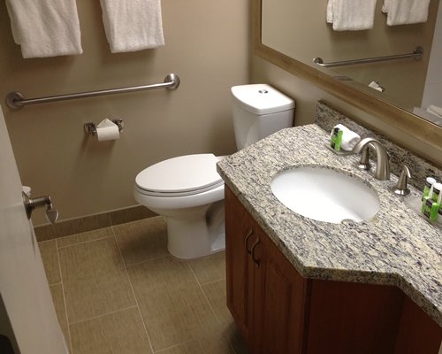 A bathroom with a closed sink vanity.