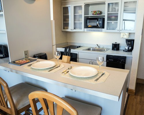 A well equipped kitchen and breakfast bar.