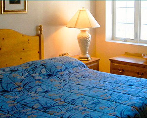 A well furnished bedroom with a queen bed.