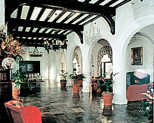 Resort lounge area with a fire in the fireplace.