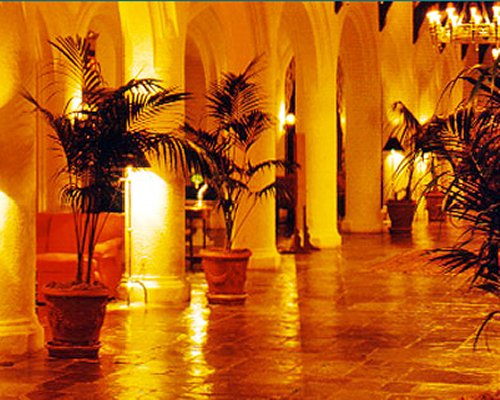 Interior pathway alongside a lounge area.