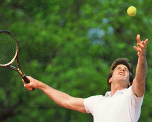 A man playing badminton.