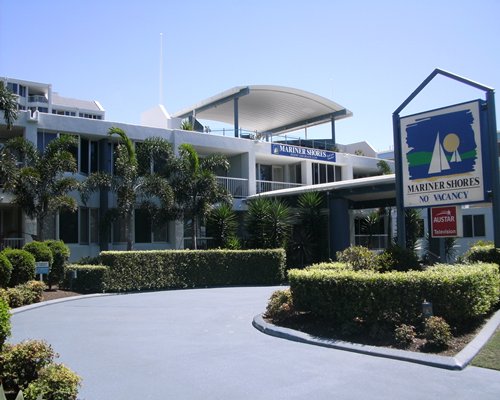 Entrance to Mariner Shores Resort with a signboard.