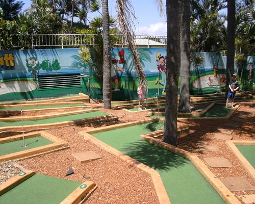 A putt putt golf course surrounded by trees.