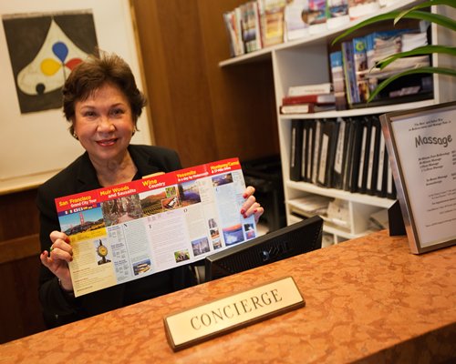 A woman showing resort brochure.