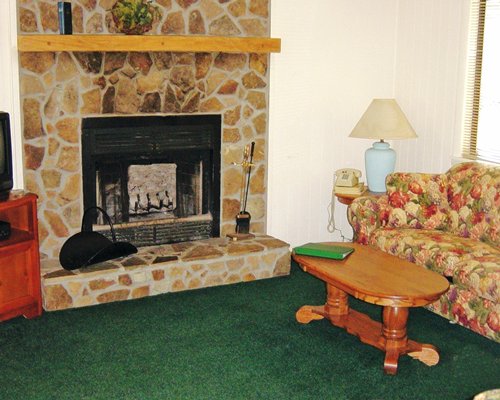 A well furnished living room with a fireplace.