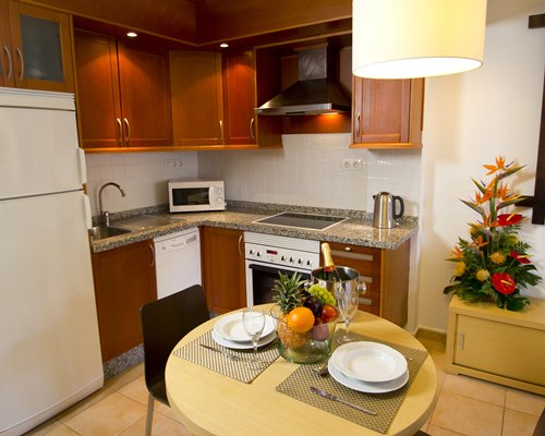 An open plan dining and kitchen area with a microwave oven.