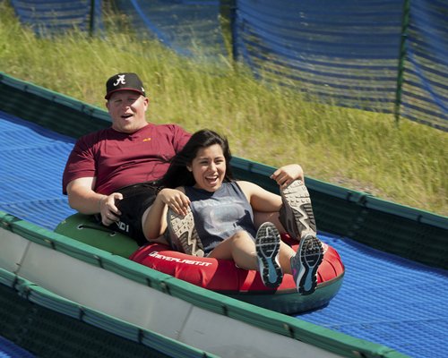 A couple sliding on a float.