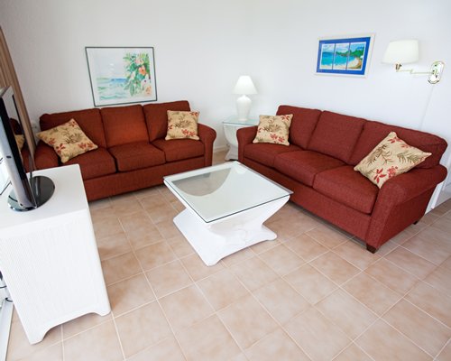 A well furnished living room with a television.